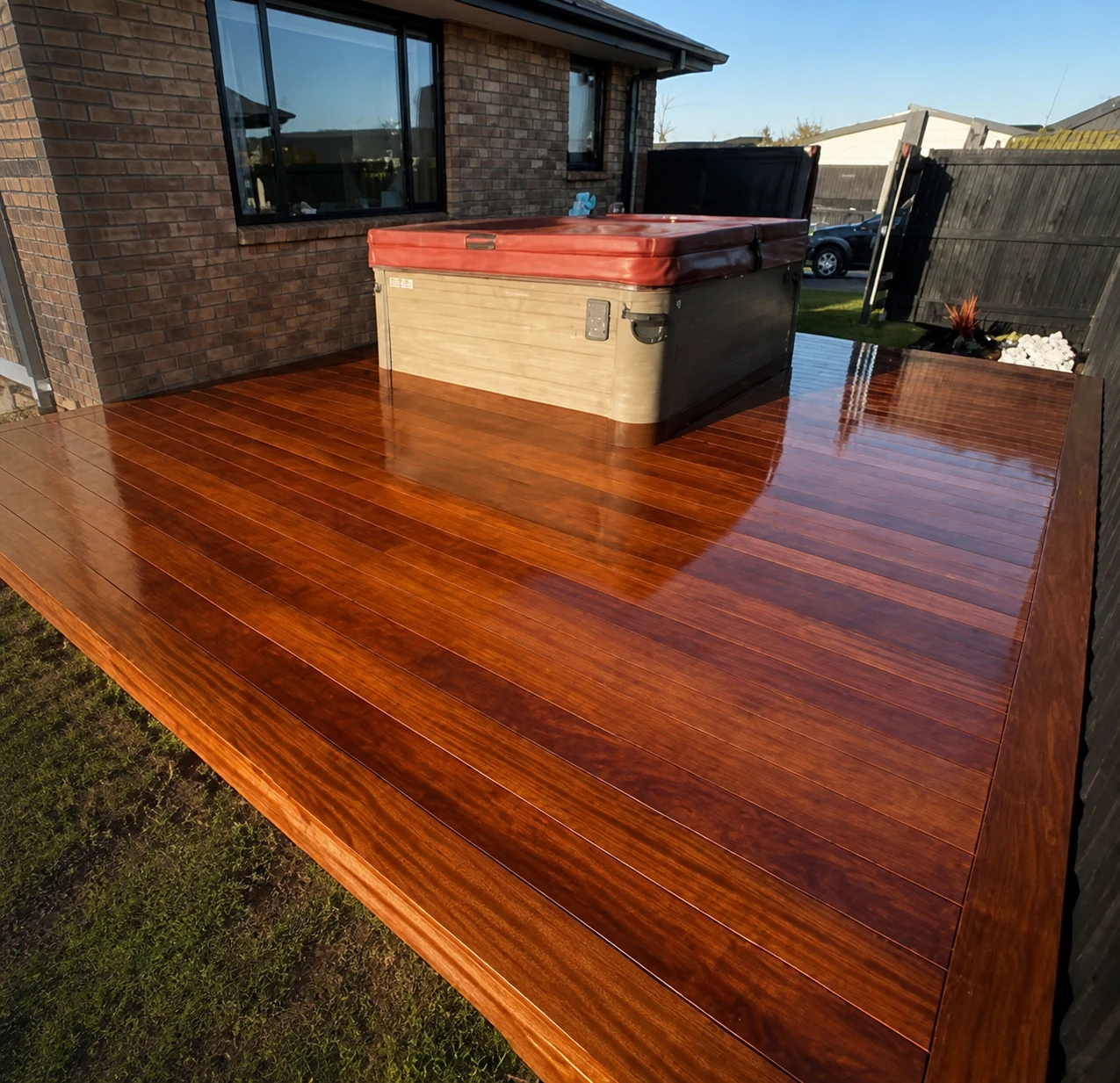 Finished timber spa deck built by Aaron